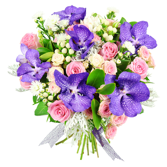 In this refined bouquet, every detail has been composed to showcase the interplay of colour, texture, and light, as if prepared by a seasoned Queensbury florist for a cherished local celebration. A cluster of striking Vanda orchids dominates the design, their petals a rich blend of deep purple and indigo tones, intricately mottled with lighter speckles that lend each bloom a distinctive, almost opalescent character. These orchids are thoughtfully spaced through the arrangement so that their dramatic presence can be appreciated from every angle. Cradling them, pastel pink roses unfold at different stages of bloom, from neat, tightly wrapped buds to lavish, open flowers with gently curving petals that suggest tenderness and devotion. Smaller creamy white spray roses are nestled among them, tucked into pockets of green to give the bouquet volume and a soft, rounded silhouette. Threaded throughout are fine sprays of delicate white filler flowers and smooth clusters of white hypericum berries, which introduce a fresh, clean brightness. Soft, silvery-grey dusty miller foliage adds a cool, velvety texture that contrasts beautifully with the glossy dark green leaves providing a structured, verdant frame. The entire hand-tied design is bound at the base with a shimmering ribbon in tones of lavender and silver, its sheer material catching the light and echoing the orchids' iridescent qualities. Photographed against a white background, the arrangement feels both luxurious and serene-ideal for anniversaries, milestone birthdays, or elegant congratulations, and perfectly suited to same-day delivery around Queensbury's homes, offices, and quiet residential streets.
