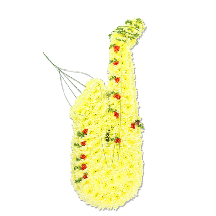A large, bespoke floral tribute in the exact shape of a saxophone stands out crisply against a white studio background, every line of the instrument carefully rendered in petals and foliage. The entire body, from the narrow top section where the mouthpiece would sit down to the wide, rounded bell, is completely covered in dense clusters of bright yellow chrysanthemums. Their small, cushion-like heads are packed close together so the saxophone appears smooth and plush, with a soft, almost velour texture instead of hard brass. Light glances off the bloomy surface, creating patchworks of buttery and sunshine tones that follow the instrument's familiar outline. Scattered across this golden field are numerous miniature red roses and rosebuds, placed where the keys and buttons of a real saxophone would lie, each bud adding a jewel-like point of colour and hinting at the loved one's favourite melodies. Woven subtly through the design, fine tendrils of dark green foliage coil along the contours, defining the curve of the neck, the sweep of the body, and the rim of the bell. These touches of greenery give the piece depth and movement, as if a tune might drift from the flowers themselves. Near the upper left, slim floral wires and stems rise from the mouthpiece area, barely visible but essential in supporting the tribute's upright stance. This kind of arrangement would be chosen by a family in Queensbury wanting to honour a musician, music teacher, or jazz enthusiast at a funeral service or memorial gathering, perhaps at a nearby chapel or cemetery. The yellow chrysanthemums speak of friendship and remembrance, while the red roses add a tender note of love and respect, turning a musical icon into a heartfelt symbol of a life well lived.