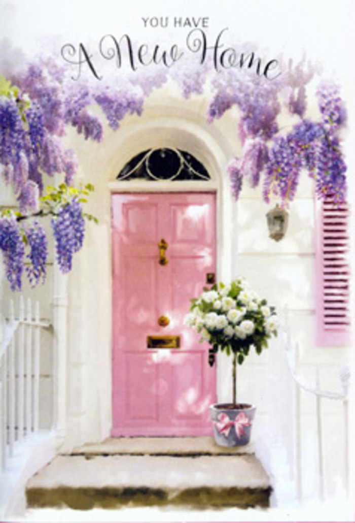 This image captures the feeling of arriving at a new address in Queensbury on a bright spring afternoon, when everything feels full of possibility. A pale pink front door, lovingly painted so that faint brushstrokes remain visible, stands at the centre of a whitewashed façade, its colour softly reflecting the daylight that drifts in from an unseen suburban street near the station. The door is framed by generous garlands of wisteria in bloom, the long, trailing clusters of lilac and lavender flowers hanging in abundant layers that overlap like ruffled silk. Their petals appear almost weightless, creating a dreamy canopy that turns the entrance into a floral archway. To the side, a pastel shutter echoes the same blush hue, tying the whole composition together in a gentle, harmonious palette of pinks, creams, and light purples. On the doorstep, a grey metal bucket serves as a charming, rustic container for a lush bouquet of white and cream roses. Each rose looks freshly cut, its petals tightly layered yet just beginning to open, with a soft satiny texture that contrasts with the cool metal of the bucket. Sprigs of green foliage weave between the blooms, adding depth and a hint of garden freshness, as if they've been gathered from a well-tended yard off Stag Lane. Around the bucket's base, a pink ribbon is tied in a simple yet elegant bow, its loose ends resting against the step like a quiet celebratory gesture. The overall atmosphere is hopeful and calm, a visual congratulations on your new home, crafted with the kind of care and attention to detail you'd expect from an experienced Queensbury florist.