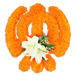 Rendered in vibrant orange and pure white, this floral Khanda is presented as a three-dimensional devotional emblem against a flawless white background. The design rests on a foundation of tightly packed orange marigolds: hundreds, if not thousands, of soft, pompom-like blooms arranged with the precision of a seasoned hand to form the chakkar's circular band and the two crossed kirpans that represent temporal and spiritual balance. The marigolds' plush texture and saturated colour catch the light and create subtle highlights across each curve and edge. Anchoring the centre, a cluster of pristine white lilies provides a calming focal point-two or more open blooms with gently unfurling petals, pale green and golden stamens, and several tucked buds that promise continued bloom. Interspersed glossy green leaves and fine sprays of baby's breath lend air and contrast, softening the bright orange and giving the composition depth and movement. A soft shadow beneath the arrangement suggests it is freestanding, created with materials meant for display at a festival, a memorial, or a ceremonial space. There's a faint, evocative scent in mind: warm marigold earthiness layered with the cool, clean perfume of lilies. As a florist serving the Queensbury community, Flower Delivery Queensbury would prepare and deliver such a reverent display for Vaisakhi, Gurpurab, or a respectful tribute, ensuring the piece reads clearly from a distance while inviting close appreciation of its tactile detail.