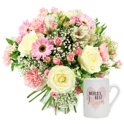 Set against a clean, white backdrop, this carefully styled image captures a gentle, love-filled gift set that feels at home in a cosy Queensbury living room flooded with soft afternoon light. To the left, a generous hand-tied bouquet is arranged in a classic domed shape, brimming with pastel blooms. Cream roses, their petals thick and velvety, create a luxurious centre, like tiny sculptures slowly opening. Around them, ruffled blush pink carnations curl at the edges, adding movement and a sense of softness to the design. Bright pink gerbera daisies with deep, almost espresso-coloured centres provide a joyful contrast, their flat faces turned outward as if smiling. Slender white alstroemeria, printed with fine reddish-brown flecks, thread between the larger flowers, while airy sprays of gypsophila settle like delicate white mist around the bouquet. Fresh green foliage breaks through here and there, reminding you of spring walks past tidy front gardens off Honeypot Lane and around the quieter streets of Queensbury. The stems are neatly gathered at the bottom, clearly hand-tied with professional care. To the right, a smooth white ceramic mug stands upright, its handle turned slightly towards the viewer. On its front, a pale, watercolour-style pink heart holds the words "WORLD'S BEST" in simple black type, with "Mum" written beneath in a flowing, metallic gold script that catches the eye. The lighting is bright but gentle, revealing the natural texture of each petal and the glossy finish of the mug. This pairing of fresh flowers and keepsake mug creates a tender visual message of gratitude and celebration, ideal for honouring a cherished mum in Queensbury, whether on Mother's Day, her birthday, or simply a day when she deserves to feel special.