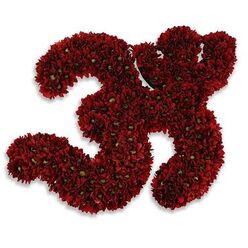 Presenting the number thirty-three sculpted entirely from dense clusters of small, deep maroon-red button chrysanthemums or asters, this arrangement reads as both symbolic and tactile. Each numeral is composed of hundreds of tiny blooms-petals layered like the scales of a finely crafted instrument-so close that the surface becomes a continuous carpet of velvety crimson. Here and there the tiny lime-green centres of individual flowers offer a delicate, living punctuation that lifts the colour and prevents it from feeling monochrome. The composition sits against an immaculate white field, the purity of the background sharpening every silhouette and bringing forward the subtle modelling of light across the petals. A soft gray shadow beneath the piece gives it a slight raised impression, as if the numbers are resting gently above the page; that elevation adds a meditative calm to the arrangement, a quiet dignity that suits both joyful milestones and reflective memorials. As a florist working in and around Queensbury, I'm conscious of how such a piece would read on local mantels and community noticeboards, carrying a clear message without needing extra adornment. The scent is understated-chalky green stems and the faint herbal trace of fresh chrysanthemums-encouraging a considered, consoling response. The overall feeling is one of respectful celebration: precise in craft, rich in tone, and quietly resolute in meaning.