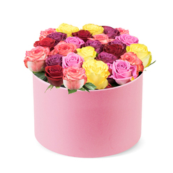 Imagine a cylindrical, soft pink hat box, brimming with roses, photographed against a clean white backdrop. The velvet-like exterior curves gently, ending in a refined lid that hints at the treasure inside. Within, around thirty to forty blooms rise in a lush, domed crown, each rose opening with a satin-smooth finish that tells of careful pruning and freshness. Colors dance together in a couture mix: sunny yellow for sunshine, crimson red and burgundy for depth, assorted pinks from pale blush to vibrant fuchsia, creamy tones that soften transitions, and even hints of purple-plum for drama. The packaging allows the blooms to speak-little if any greenery interrupts the robe of petals-creating a modern, gallery-like profile perfect for modern living rooms and reception spaces. The scent-a clear rose with a whisper of citrus and green-hangs in the air as if the garden was brought indoors. An arrangement like this signals celebration and affection, whether for a birthday, anniversary, or a special surprise on Valentine's Day. It's a piece that a discerning local customer would associate with quality delivery, reliability, and the know-how of a Queensbury florist who appreciates how to curate colour and form in harmony.