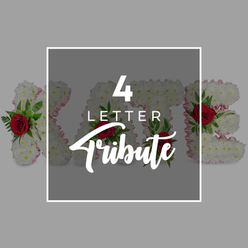 This image presents a serene and thoughtfully composed four-letter funeral tribute, the kind often chosen by families in Queensbury to rest beside a coffin or at a memorial gathering. Four large floral letters stretch across the frame, their forms crafted entirely from tightly clustered white chrysanthemums, each bloom pressed close to the next to form a smooth, cloud-like surface. Around the sides of the letters, a faint outline of pale pink ribbon peeks through, giving a gentle, almost halo-like border that softens the strong block shapes. At carefully chosen points within each letter, vibrant red roses emerge, their petals curled in graceful spirals, accompanied by rich green foliage that adds depth and structure. The contrast of the crimson roses against the pure white flowers suggests love, devotion, and remembrance, echoing the emotions felt at a funeral service held in a Queensbury church or crematorium. Dominating the centre of the picture is a dark grey semi-transparent square, bordered in white, carrying white typography that announces "4 LETTER" and, beneath it, the word "Tribute" in a sweeping script. This overlay slightly veils the floral letters without hiding them, so that the shapes of the blooms, the scarlet touches of the roses, and the greenery still show through. The background is a calm, uniform light grey which allows the floral work to stand out clearly, free of distractions. Overall, the image evokes the quiet dignity of a bespoke funeral flower arrangement, capturing the idea of custom names or meaningful words formed in flowers and delivered locally to honour a loved one from the Queensbury community.