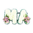 A refined and heartfelt MA letter tribute is shown in a clear, studio-style photograph, ideal for families in Queensbury browsing funeral flower options online. The two capital letters sit side by side, connected subtly along the base so they form one unified design. Each letter is completely covered in closely set white chrysanthemums, the domed flower heads pressed so tightly together that they form a smooth, padded surface, reminiscent of a soft quilt. Their crisp white petals catch the light gently, giving the arrangement a clean, peaceful presence. A deep green satin ribbon traces the outer edges of the letters, neatly pleated to create a textured border that contrasts beautifully with the snowy blooms while adding a sense of polish and definition. At the lower left base of the M and the lower right base of the A, two matching posies of pastel flowers bring a tender hint of colour. Here, soft lilac and pale pink roses open among smaller pink spray roses, some fully bloomed, others still in rounded buds, suggesting the unfolding of precious memories. Slender fern fronds arc through each cluster, their fine, feathered leaves lending height, movement, and a touch of natural wildness. The overall effect is dignified yet deeply personal, a tribute that could rest by a coffin during a service at a local chapel or arrive as a special delivery from Flower Delivery Queensbury to a funeral director on behalf of a grieving family. With its simple palette and carefully balanced design, the arrangement expresses love, gratitude, and respect for a Ma whose presence shaped everyday life.