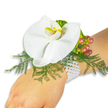 A single, pristine white Phalaenopsis orchid rests like a quiet jewel on the light-skinned wrist of a wearer, set against a crisp, shadow-free white background that lets every curve and hue speak. The orchid's broad, satin-like petals unfurl with calm confidence, and its labellum offers a small, sunlit splash of yellow warmed toward golden-orange at the throat, drawing the eye to the bloom's elegant centre. Below and around the flower, airy fronds of asparagus fern form a soft, feathery cradle - bright, fresh green that breathes a woodland coolness into the composition and contrasts cleanly with the orchid's pure white. To the upper right, a compact cluster of glossy Hypericum berries provides a tactile counterpoint: each berry slides through a subtle gradient of colour from pale green to warm rose and deep cranberry, suggesting ripeness and seasonal charm. A ruffled, lime-green accent foliage threads near the berries, adding a delicate, almost textile-like texture. The whole piece is affixed to the wrist on a classic multi-strand bracelet of small white pearls; their gentle lustre catches the light and reads like an heirloom, secure yet comfortable against the skin. In soft daylight the arrangement smells faintly of green leaves and floral sweetness, evoking quiet celebration-prom, wedding, anniversary or an intimate hometown gathering near Queensbury station. As a florist's handiwork, the corsage balances sculptural form and wearable comfort: taut lines of pearl and the orchid's rounded openness combine to make an accessory that feels both refined and approachable, a moment of floral grace captured for a special day.
