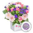 In a bright Queensbury display window, this vibrant, celebratory bouquet glows from a crisp white square presentation box, a modern touch that frames the romance inside. The arrangement centers on soft pink roses, their buds opening into velvet, romantic blossoms with petals that seem to sigh with gentle blush. Intertwined are pastel pink gerbera daisies, their round faces radiating cheer, each petal edged in white and a pale yellow center catching the light like tiny suns. Scattered among them are clusters of deep purple statice, adding a moment of jewel-like contrast and delicate texture that gives the bouquet depth without overpowering its sweetness. Lush green foliage surrounds the blooms, varying in leaf shape and shade to create a fresh, garden-fresh backdrop that makes every petal glow. The box itself is pristine white, square and elegant, with a subtle red rose motif that hints at a careful, local touch from a Queensbury florist. In the lower right corner floats a round foil balloon, its central purple panel bearing the silver inscription You're Engaged!, framed by a white rim sprinkled with tiny pastel hearts and silver stars. The overall impression is one of joyful celebration and romantic promise-a thoughtful gift perfectly suited for congratulating a newly engaged couple. Available for same-day delivery across Queensbury and nearby neighbourhoods like Kingsbury and Burnt Oak, this bouquet brings brightness, warmth, and a sense of new beginnings to any home or workspace.
