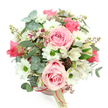This photograph captures a beautifully composed hatbox bouquet, styled with the kind of care you might expect from a dedicated Queensbury florist. Set against a pure white background, the soft blush-pink round box stands out with gentle charm, encircled by a narrow, deeper pink satin ribbon. A cream tag with subtle branding dangles from the bow, suggesting a high-quality, ready-to-gift arrangement. The flowers rise in a rounded, domed shape, brimming with texture and delicate colour. Light-pink roses dominate the centre and edges, some fully open to reveal plush, spiralling petals, others just beginning to unfurl, creating a sense of softness and evolving emotion. Between the roses, crisp white daisy-like chrysanthemums with striking green centres bring a clean, cheerful brightness that lifts the whole arrangement, like a shaft of sunlight over the residential streets and pocket parks around Queensbury. Nestled among them, white alstroemerias etched with slender purplish-red streaks add intricate, almost hand-painted detail. The greenery is equally thoughtful: silvery eucalyptus leaves, rounded and slightly matte, arc gently around the blooms, providing a cool, calming counterpoint to the warm pinks, while darker, strap-like foliage fills the spaces and deepens the shadows. Small clusters of reddish-brown buds or berry accents punctuate the softer tones, giving the bouquet an understated, naturalistic charm. The overall impression is of gentle romance and refined comfort, an arrangement perfect for sending love, congratulations, or a quiet thank-you with same-day delivery in and around Queensbury, whether to brighten a living room, grace a bedside table, or offer a tender surprise from afar.