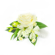 A delicate wrist corsage captured against a clean white backdrop, its central focus a single, creamy white rose whose tightly furled heart unfurls in layered, velvety petals. Surrounding the rose are two soft, alstroemeria-like blooms with elongated ivory petals that arch gently outward, while to the left a pair of narrow green buds sit poised, promising more blooms. Nestled beneath, a scatter of tiny white daisy-like flowers with minute yellow centres offers a playful, countryside charm, their fine petals creating tiny points of light among deeper tones. Lush, broad dark-green foliage forms a rich base, the smooth leaves providing cool contrast and framing the floral cluster so that the whites read as pure and luminous. To the right, a small string of glossy white pearls is tucked between petals and leaves, catching the light with a quiet, bridal glimmer and lending the piece a timeless, jewellery-like grace. The lighting is soft and even, throwing subtle shadows that reveal the rose's depth and the alstroemeria's delicate veins; the overall texture reads as both tactile and ethereal, suggesting a faint floral sweetness and the cool, satiny touch of pearl. Imagined for a wedding, prom, or formal celebration, this arrangement radiates restraint and elegant simplicity: purity in bloom, the hush of imminent vows, and the precise handiwork of an experienced florist who composes with balance and tenderness. For local clients in Queensbury seeking a refined accessory with a hint of traditional glamour, this corsage suggests both quiet confidence and a heartfelt, personal touch.