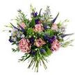 This hand-tied bouquet reads like a memory of a breezy Queensbury meadow at late spring: soft antique-pink roses, some just unfurling and others held in tighter buds, form the gentle centre of the arrangement. Two fuller, mauve-pink carnations introduce a ruffled, velvety texture that contrasts with the roses' smooth petals, while upright spikes of deep indigo-veronica push upward, adding vertical drama and a cool, jewel-toned punctuation. Scattered through the blooms are clusters of small, aster-like flowers in pale lavender-blue with tiny yellow eyes, their starry faces lending an airy, wild-garden softness. Deeper purple lisianthus (eustoma) blooms and buds nestle in the shadows, giving occasional pools of concentrated colour that catch the eye. The palette is grounded by rounded, silvery-green eucalyptus leaves that reflect a muted light and by a bright lime-green textural filler-reminiscent of Santini chrysanthemums or similar bushy foliage-that cushions the composition and makes the pastel tones sing. Slender green leaves and emerging buds weave between the flowers, reinforcing a freshly gathered, organic silhouette. The stems are gathered and visible at the base, revealing the bouquet's hand-tied construction and the florist's intentional yet loose styling. Under soft, natural light the arrangement feels serene and uplifting, with a subtle, green-floral scent like early morning in a local community garden. Perfect for sending gentle affection, a birthday greeting, or to brighten a favourite room, this bouquet carries the quiet joy of seasonal blossoms picked with care in Queensbury and its neighbouring greenspaces.