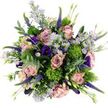 Seen from above against a bright white surface, this hand-tied bouquet looks like a carefully painted circle of garden colour, the kind of arrangement you might find gracing a dining table in Queensbury after a thoughtful surprise delivery. At the core are full, velvety roses in shades of blush, dusty pink, and soft mauve, their spiralling petals opening wide to reveal creamy centres and creating a romantic, almost vintage feel. Between them, small daisy-like asters in pale lavender and lilac punctuate the design, each with a golden-yellow centre that adds a subtle sparkle and prevents the palette from ever feeling flat. Richly coloured lisianthus in deep purple weave among the roses, some blooms fully open, others still in graceful, sculptural buds, contributing both drama and a sense of unfolding life. Tall, slender spires of Veronica rise here and there, covered in tiny purple florets that introduce vertical movement, as if the flowers are stretching toward soft window light on a calm afternoon off Streatfield Road. Nestled throughout the arrangement are bright chartreuse green, cushion-like clusters reminiscent of Green Trick dianthus or viburnum, whose quirky, mossy texture contrasts playfully with the smoother rose petals. Encircling everything, long stems of eucalyptus with silvery-green leaves arc outward, their muted tone and gentle curves framing the bouquet while hinting at a cool, refreshing fragrance. Extra foliage and small buds fill the gaps, making the bouquet feel dense, plush, and expertly composed. The overall mood is tender yet confident, a harmonious blend of colour and texture that suits birthdays, anniversaries, or quiet thinking of you gestures delivered to loved ones throughout Queensbury.