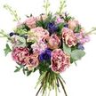 A richly textured, hand-tied bouquet fills the frame, set against a pure white background that accentuates every nuance of colour and form, as if freshly prepared in a Queensbury florist's workroom. The arrangement is lush and rounded, built around a heart of roses in dusty rose pink and soft peach, some fully unfurled with layered, velvety petals, others still held in tight buds that promise future blossoms. Surrounding these central blooms are abundant carnations, their fringed, ruffled petals creating a sense of movement; the petals shift from bold magenta tips to a softened blush centre, adding both vibrancy and romance. Scattered throughout are deep indigo and violet-blue anemones, each bearing a dark, almost black eye that becomes a focal point amidst the gentler, pastel tones, much like a dramatic accent in an otherwise calm Queensbury evening sky. Slender stems of lavender and pale pink stock rise delicately through the design, densely studded with small florets that lend a feathery, almost cloud-like texture and hint at a light, soothing fragrance. The bouquet is framed by a generous selection of foliage: rounded, silvery eucalyptus leaves mingle with broader, darker greenery, creating a cool, layered backdrop that makes the flowers' colours stand out. At the base, the natural green and woody stems are visible, neatly gathered to show the hand-tied craftsmanship and garden-fresh quality. Bathed in bright, even lighting, every petal, leaf, and shadow is rendered with clarity, making this bouquet ideal for romantic gestures, thoughtful sympathy tributes, or elegant home décor in and around Queensbury.