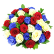 A lush, domed bouquet of roughly three dozen roses in saturated red, pristine white, and striking cobalt blue is presented against a spotless white background, creating a clean, gallery-like setting that draws the eye straight to the flowers. The roses are tightly clustered, each bloom at full or near-full opening, revealing spirals of velvety petals that overlap like soft fabric, some petals just beginning to curl back at the edges. The three colours are meticulously interspersed so that the red, white, and blue are evenly distributed, evoking a sense of balance and patriotic symbolism without any one hue overpowering the others. Between the blooms, hints of deep green foliage appear, the leaves glossy and firm, shaping the bouquet into a smooth rounded silhouette and lending natural depth to the vibrant palette. The bright, even lighting highlights every curve and shadow, emphasizing the freshness of the roses and making them appear almost three-dimensional, as though you could reach out and feel the cool, silky surface of each petal. This is the kind of thoughtfully composed arrangement a local florist in Queensbury might prepare for a milestone celebration, a remembrance gathering near the local memorials, or a themed party in a home off Honeypot Lane. The atmosphere it conveys is both celebratory and respectful, ideal for imagining a centrepiece that honours shared traditions and community spirit, while still offering the simple pleasure of beautifully crafted, fresh seasonal roses delivered with care to homes and venues across Queensbury.